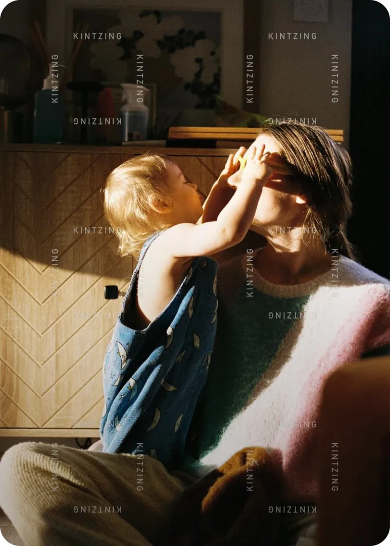Grandparent and child sharing a tender moment indoors