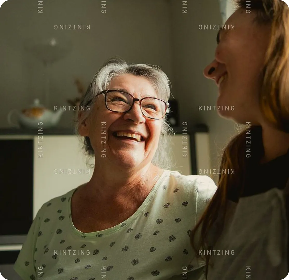 Friends sharing a joyful conversation at home