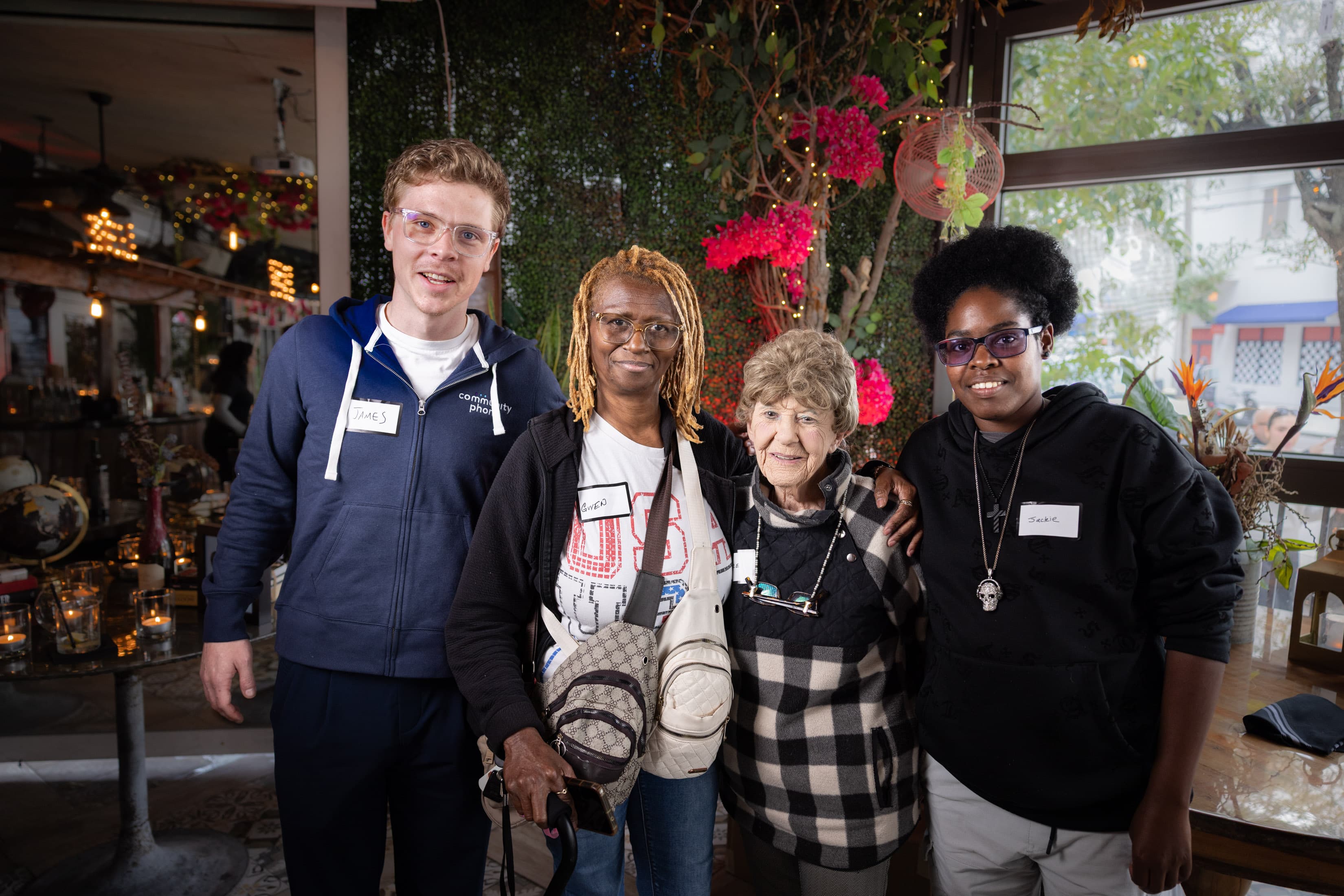 Community Phone team members with customers at a community event